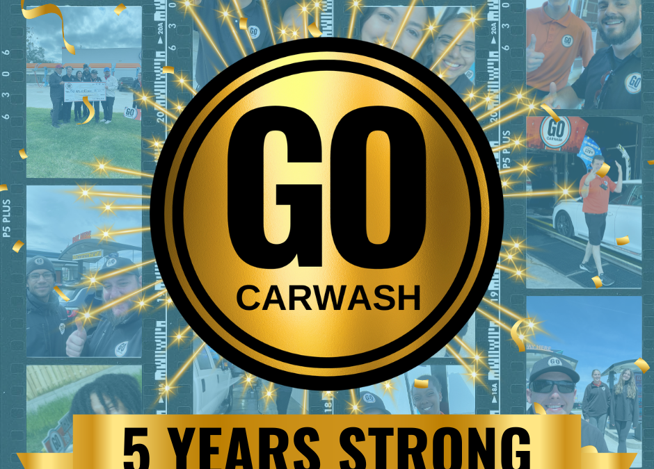 Celebratory image for GO Carwash's 5th anniversary. The image features a large gold medallion with the text "GO Carwash" in the center, surrounded by sparkling effects. Below the medallion, a gold banner reads "5 Years Strong." The background is a collage of photos showing staff and customers at various GO Carwash locations.